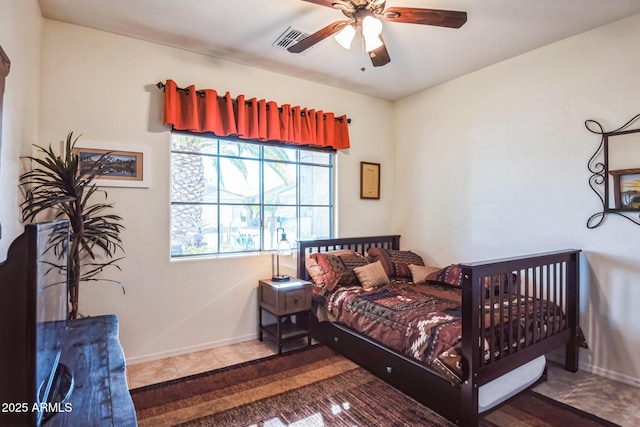 bedroom featuring tile patterned floors and ceiling fan