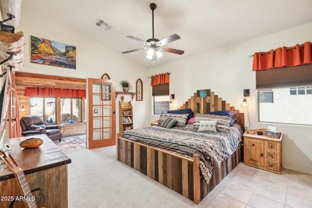 bedroom with ceiling fan, light tile patterned floors, and french doors