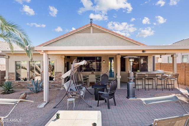 view of patio / terrace featuring exterior bar