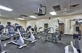 workout area with a paneled ceiling