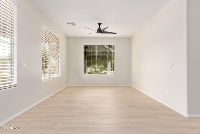 unfurnished room with light hardwood / wood-style flooring and ceiling fan