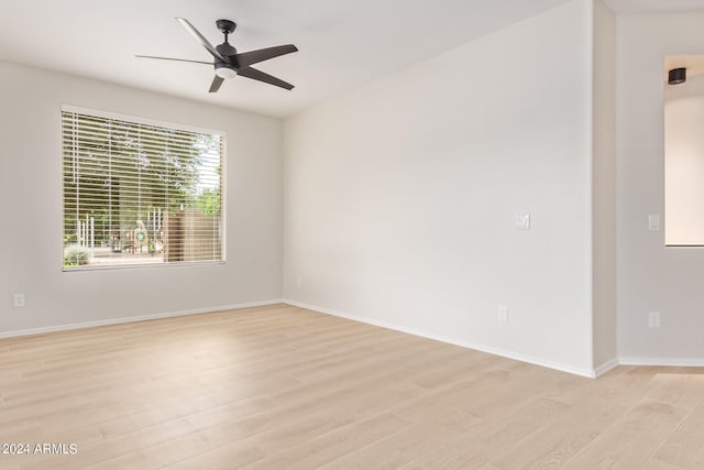 unfurnished room featuring light wood-type flooring and ceiling fan