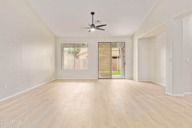 spare room with light hardwood / wood-style flooring, ceiling fan, and vaulted ceiling