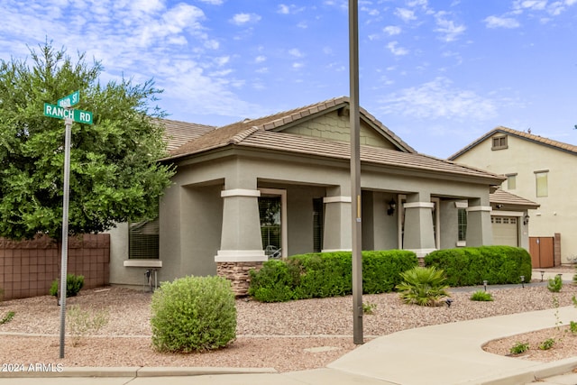 view of front of house with a garage and a porch