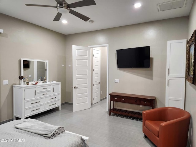 bedroom with light tile floors and ceiling fan