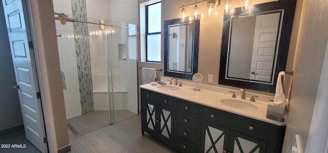 bathroom featuring walk in shower, dual sinks, tile floors, and oversized vanity