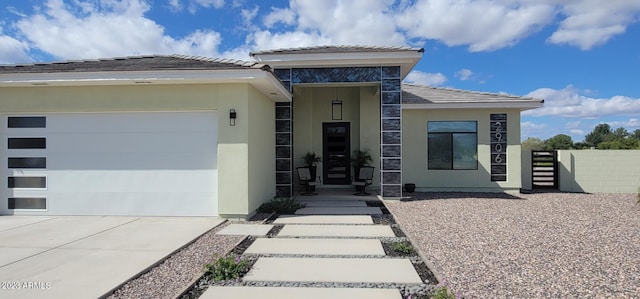 view of exterior entry with a garage