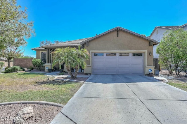 ranch-style house featuring a garage and a front yard