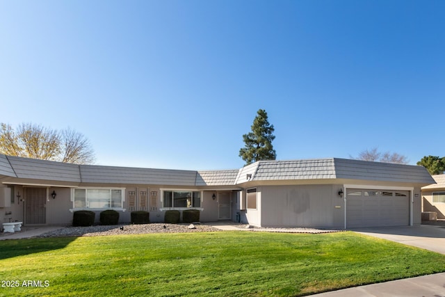 ranch-style home featuring a front lawn and a garage