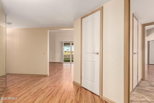 hall with light hardwood / wood-style floors