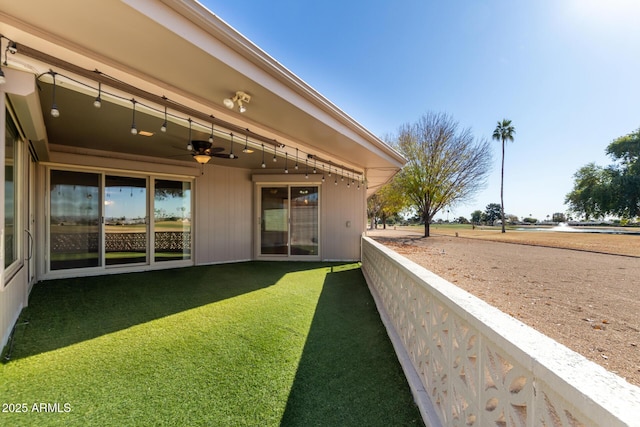 view of yard with ceiling fan