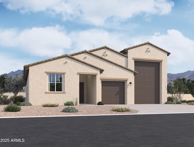 view of front facade with a mountain view and a garage