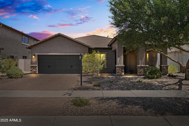 3022 E Santa Fe Ln, Gilbert, AZ 85297 - view of front of home featuring a garage, stucco siding, a tiled roof, driveway, and stone siding