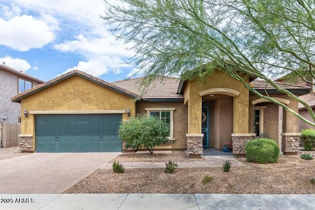 3022 E Santa Fe Ln, Gilbert, AZ 85297 - single story home with stone siding, a garage, stucco siding, and driveway