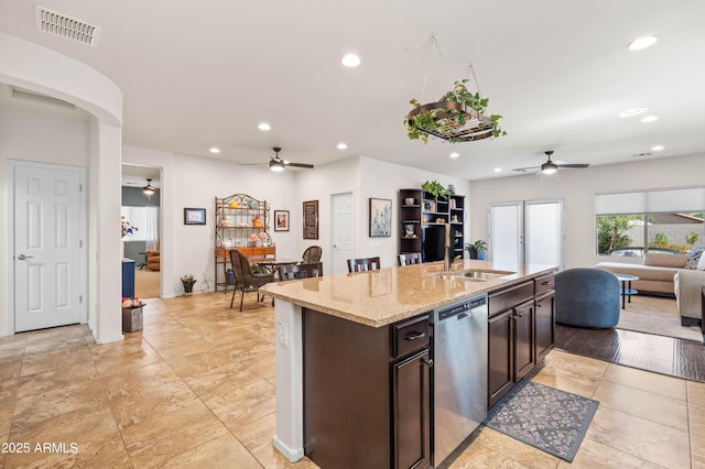 3022 E Santa Fe Ln, Gilbert, AZ 85297 - kitchen featuring ceiling fan, dishwasher, open floor plan, a center island with sink, and light stone countertops