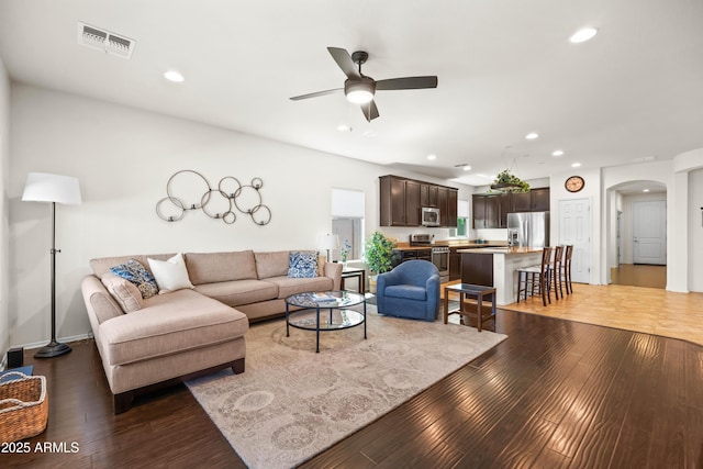 3022 E Santa Fe Ln, Gilbert, AZ 85297 - living room with arched walkways, a ceiling fan, light wood-style floors, and recessed lighting