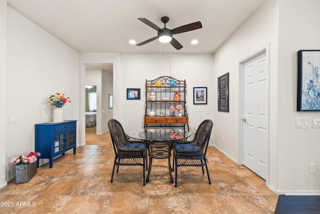 3022 E Santa Fe Ln, Gilbert, AZ 85297 - dining space with a ceiling fan, light stone finish flooring, and recessed lighting