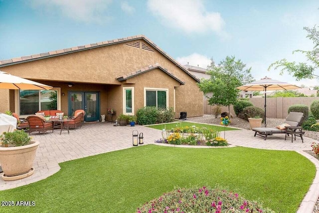 3022 E Santa Fe Ln, Gilbert, AZ 85297 - back of property featuring outdoor lounge area, a patio, and stucco siding