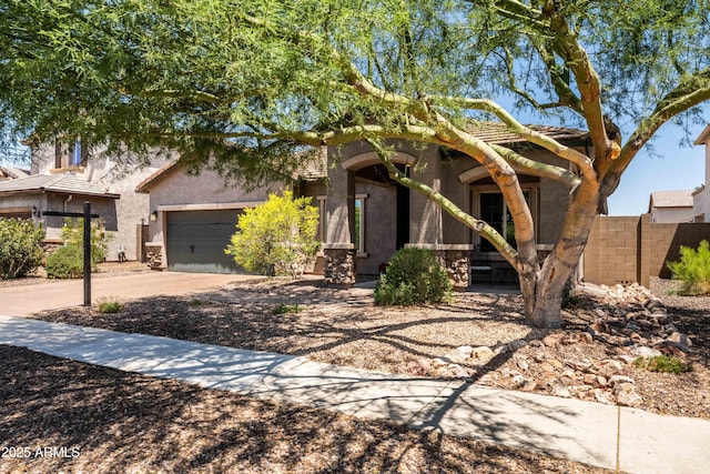 3022 E Santa Fe Ln, Gilbert, AZ 85297 - view of front of house with driveway, stucco siding, and a garage