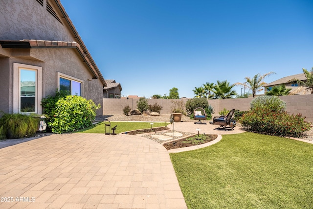 3022 E Santa Fe Ln, Gilbert, AZ 85297 - fenced backyard with a patio area