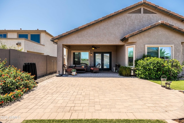 3022 E Santa Fe Ln, Gilbert, AZ 85297 - back of property with french doors, a ceiling fan, stucco siding, and a patio