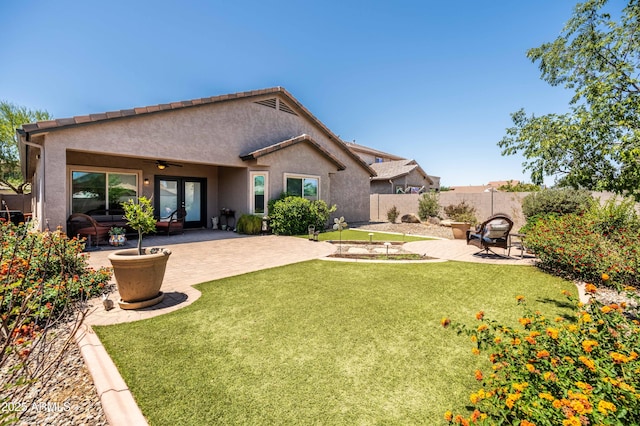 3022 E Santa Fe Ln, Gilbert, AZ 85297 - back of house with french doors, a fenced backyard, stucco siding, and a patio area