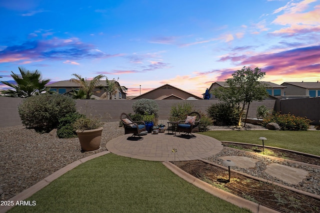 3022 E Santa Fe Ln, Gilbert, AZ 85297 - yard at dusk with a patio and a fenced backyard