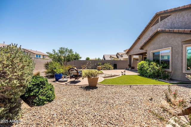3022 E Santa Fe Ln, Gilbert, AZ 85297 - fenced backyard with a patio area