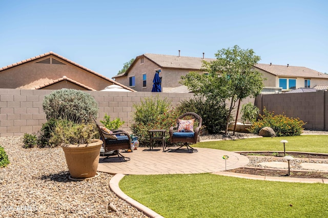 3022 E Santa Fe Ln, Gilbert, AZ 85297 - fenced backyard with a patio area