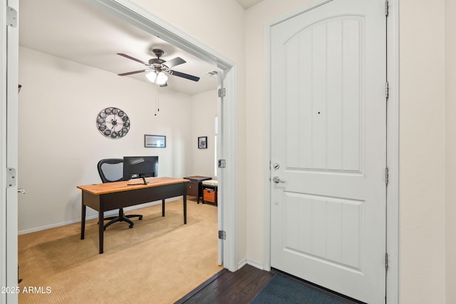 3022 E Santa Fe Ln, Gilbert, AZ 85297 - office with ceiling fan, dark colored carpet, and dark wood finished floors