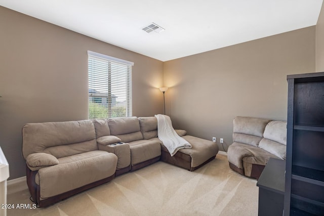 living room with light carpet and baseboards