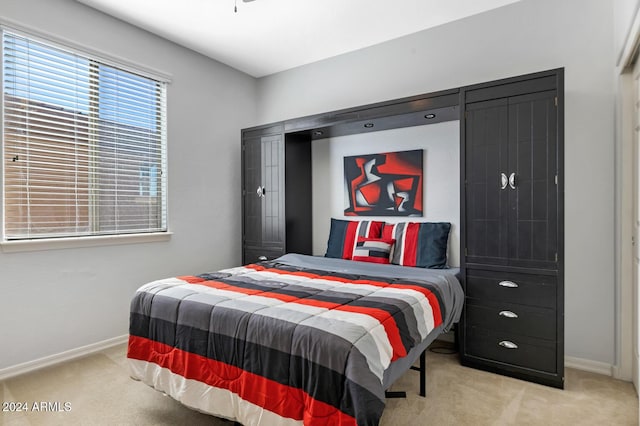 carpeted bedroom with baseboards