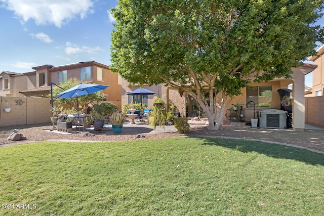 view of yard featuring a patio area and central AC unit