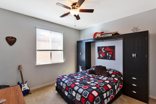 carpeted bedroom with ceiling fan