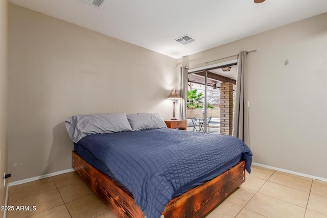 tiled bedroom featuring access to outside