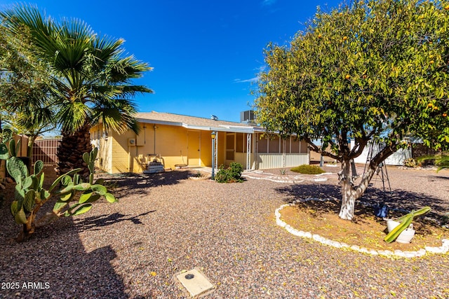 rear view of property with a sunroom