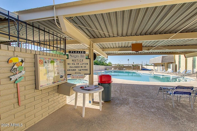 community pool featuring a patio area