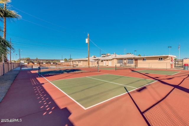 view of sport court featuring community basketball court and fence