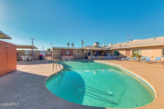 pool featuring a patio area