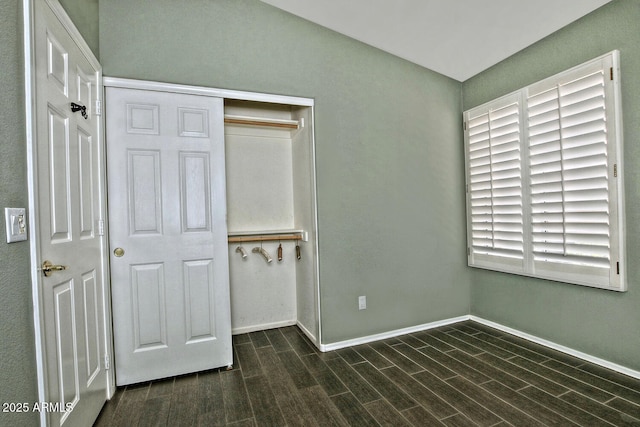 1741 S Clearview Ave Unit 13, Mesa, AZ 85209 - unfurnished bedroom featuring a closet and dark wood finished floors