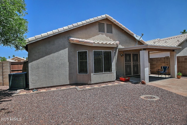 1741 S Clearview Ave Unit 13, Mesa, AZ 85209 - rear view of house with a patio area, stucco siding, and a tile roof
