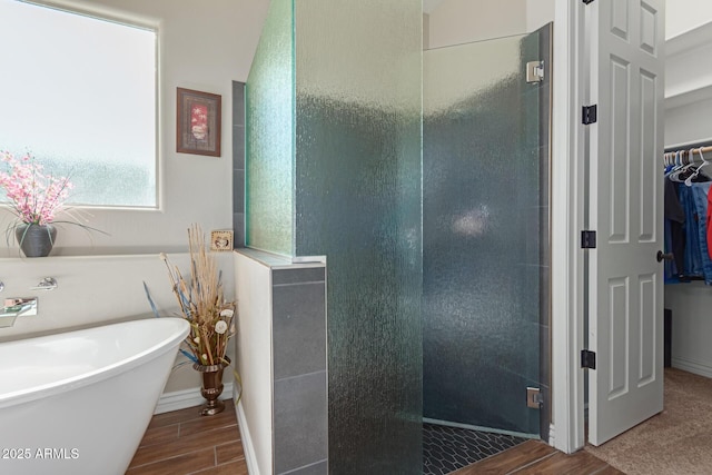 bathroom with separate shower and tub