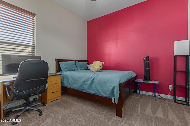 bedroom featuring ceiling fan and dark colored carpet