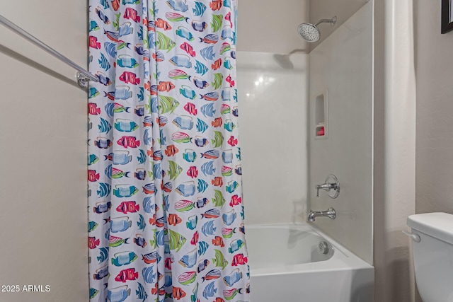 bathroom featuring shower / bath combo with shower curtain and toilet