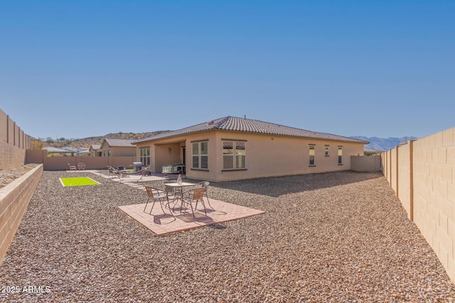 rear view of house featuring a patio