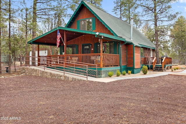 chalet / cabin featuring covered porch