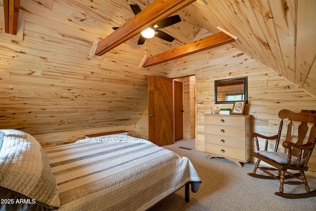 carpeted bedroom with lofted ceiling with beams, wood walls, and wood ceiling