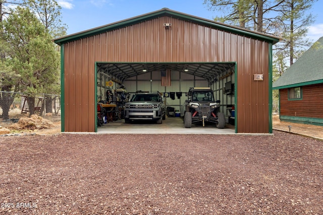 view of outbuilding featuring an outbuilding and fence