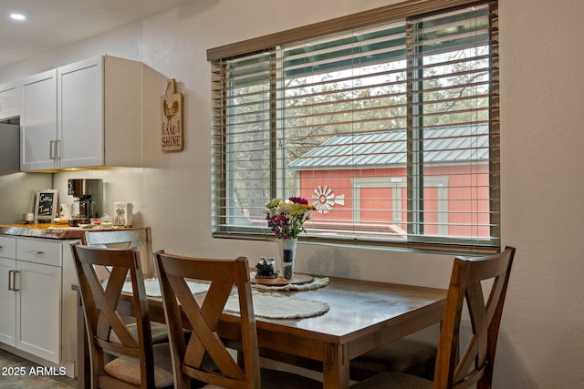 dining room featuring a textured wall