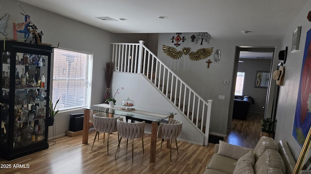 10036 W Chipman Rd, Tolleson, AZ 85353 - dining area featuring wood finished floors and stairway